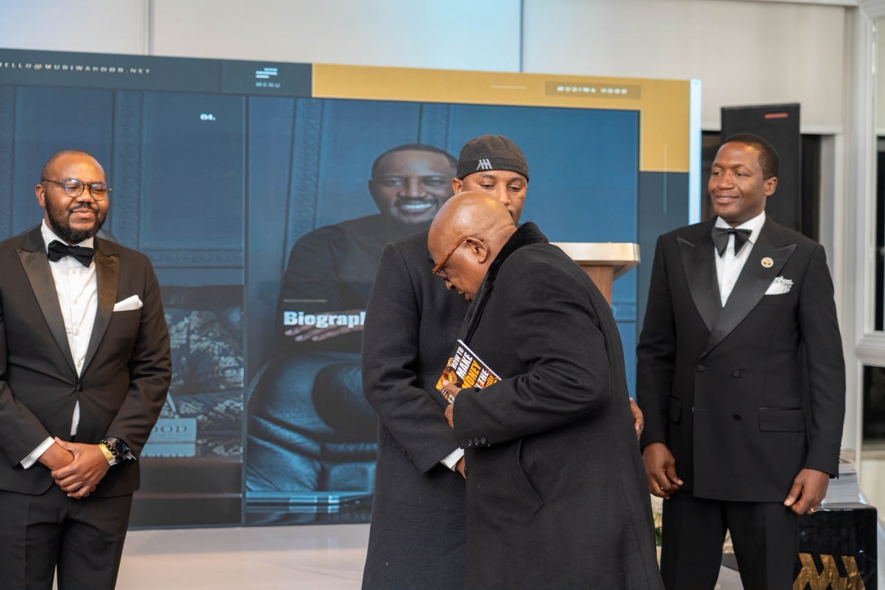 Mudiwa Hood embraces a guest after signing